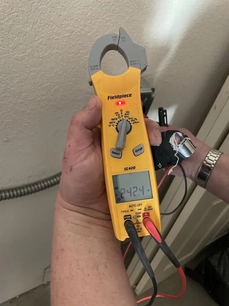 Voltage testing with clamp meter during Electrical Installation Services in Greendale
